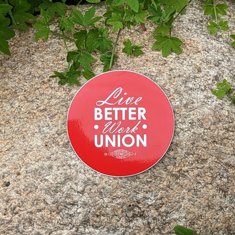 red background with text "live better work union" sticker