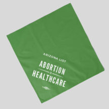 green bandana with the text "abortion is healthcare" in white