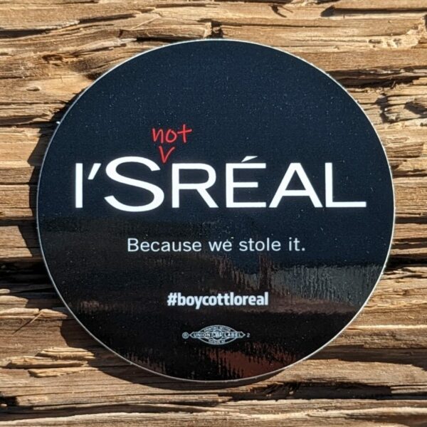 black 3" round sticker Sticker reads: I'S (Not) REAL Because we stole it. #BoycottLoreal A union bug sits at the bottom