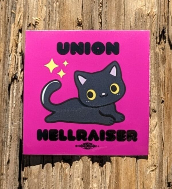 pink square sticker with a black cat at the center and text above saying union and text below saying hellraiser. sticker by Samantha Trueblood